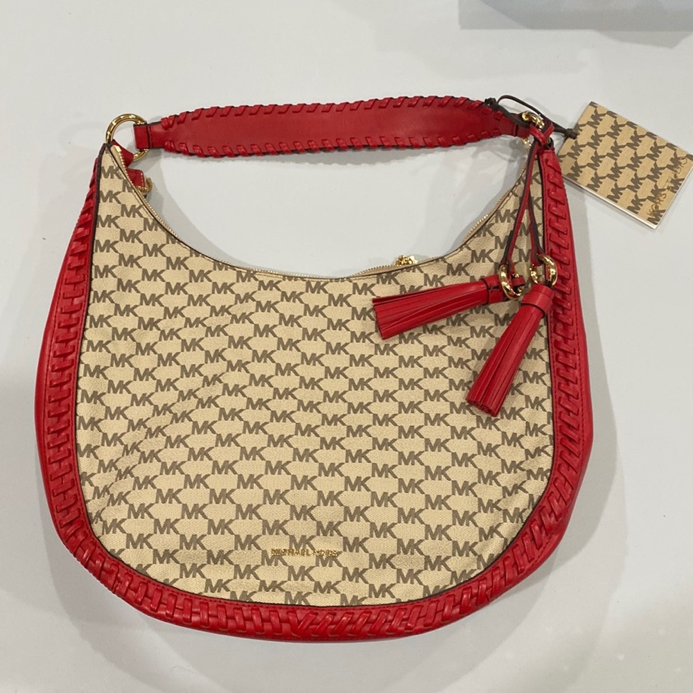 Michael kors bag with red trim and tassels